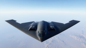 B-2 Spirit Stealth Bomber Flying Over Snowy Terrain, Aerial Photograph. Modern Military Aviation and Technology Concept. Blue Sky background