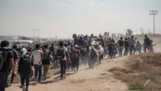 Illustration of mass immigration of people, the concept of social problems. Large group of refugees walking on a dusty road, representing the mass movement and challenges they face.
