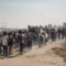 Illustration of mass immigration of people, the concept of social problems. Large group of refugees walking on a dusty road, representing the mass movement and challenges they face.