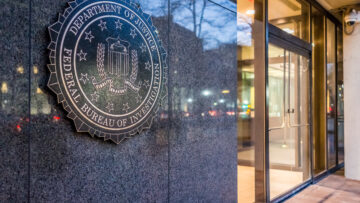 Washington DC, USA – December 29, 2016: FBI, Federal Bureau of Investigation Headquarters, on Pennsylvania avenue sign with traffic reflections at night
