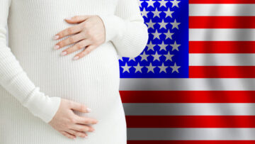 Beautiful pregnant woman belly against American flag background. Demographics and pregnancy in USA concept