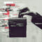 A hand holding a ballot box merged with fake news and manipulated algorithms, highlighting election interference