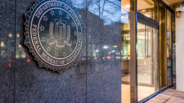 Washington DC, USA – December 29, 2016: FBI, Federal Bureau of Investigation Headquarters, on Pennsylvania avenue sign with traffic reflections at night