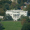Aerial view of the White House from the top of the Washington Monument in Washington DC, surrounded by trees and city buildings