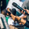 Journalists Interviewing. Female Speaker Answering Questions