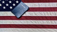 American Flag And Bible. The United States flag and a King James Bible.