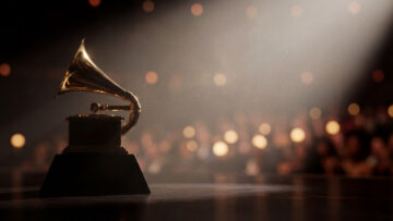 Golden trophy under stage spotlight. Grammy trophy on podium for Grammy Awards Ceremony promo, music awards show night, trophy glow with bokeh crowd, copy space, gala theme, luxury concept