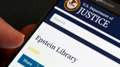 Epstein Library on U.S. Department of Justice justice.gov displayed on smartphone screen with DOJ seal, search field and share button in close-up. Stafford, United Kingdom, February 1, 2026,