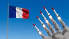 French nuclear arsenal concept a powerful display of military might with missiles launching against a clear blue sky, alongside the waving french flag, symbolizing national defense
