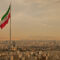 Iran Flag in the Wind Above Skyline of Tehran