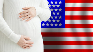 Beautiful pregnant woman belly against American flag background. Demographics and pregnancy in USA concept