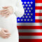 Beautiful pregnant woman belly against American flag background. Demographics and pregnancy in USA concept