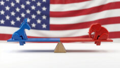US political balance concept: Democrat donkey and Republican elephant on seesaw against American flag.