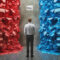 Poll concept image with a man counting ballot paper of two colors blue and red