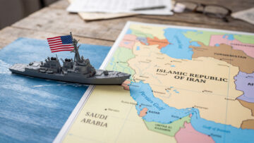 A toy US warship on the map of the Persian Gulf,