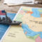 A toy US warship on the map of the Persian Gulf,