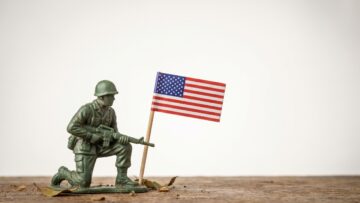 Memorial Day with a green toy soldier and American flag on a white background, national day concept with copy space for text