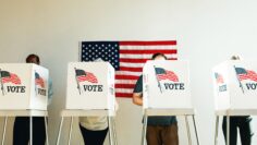 US election day, Diverse people at voting booth at US election station with American flag in background. Diverse people in line to vote at US election day. Vote for American democracy.