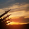 The missiles are aimed at the sky at sunset. Nuclear bomb, chemical weapons, missile defense.